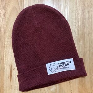 Primary Color. Music long maroon cuffed beanie.